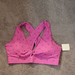 Vibrant Pink Sports Bra with Racerback and Breathable Texture